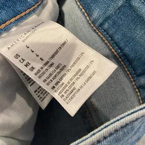 American Eagle Size 4 Next Level Stretch White Lace Pockets Cut Off Jean Shirts thumbnail 8