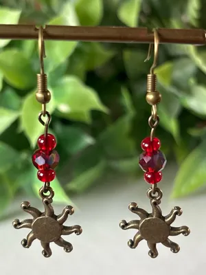 Handmade brass sun earrings with red crystal beads thumbnail 1