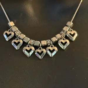 Silver tone dangling hearts charm necklace thumbnail 2