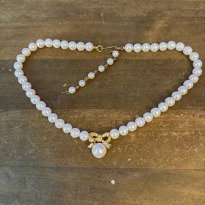 Vintage white pearl rhinestone bow pendant necklace thumbnail 2