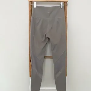 Athleta gray beige tan leggings mesh detail thumbnail 2