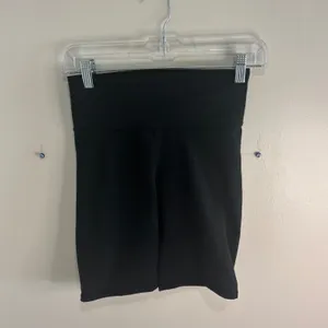 Fabletics PowerHold Black High Waisted Biker Shorts with Pockets Womens thumbnail 8