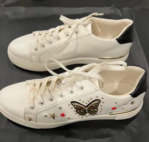 Aldo white sneakers with gold star and red flower embellishments, size US 9 thumbnail 1