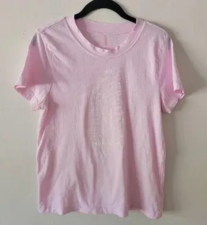 Super cute free people top it’s very worn. The pink is kind of washed out in the photo but not really in person. thumbnail 1
