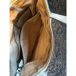 Signature coach bag with accent thumbnail 9