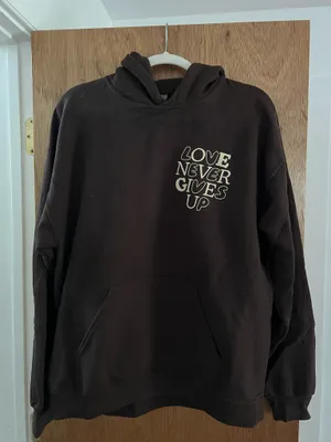 Vintage chocolate brown love never gives up hoodie thumbnail 1