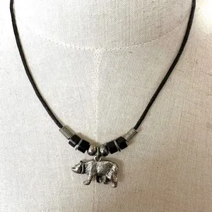 Silver tone bear pendant necklace on black cord thumbnail 1