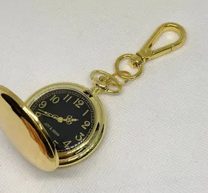joy & iman Women’s gold tone pocket watch black dial Quartz analog 46mm running thumbnail 1