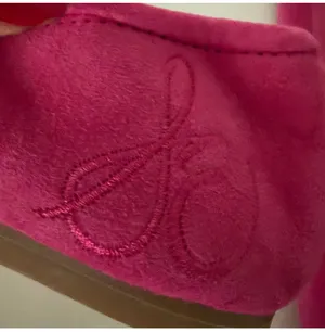 Vibrant pink suede, leather ballet flats by Sam Edelman. Featuring a rounded toe with silver logo charm detail. Perfect for adding flair to any outfit. thumbnail 5