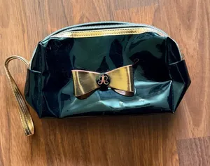 Anastasia Beverly Hills Black Patent Cosmetic Wristlet with Gold Bow thumbnail 1