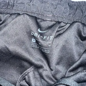 Nike Dri Fit Tempo Shorts Womens Medium Black White Trim Brief Lined Running C thumbnail 2