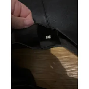 Black slouchy vegan leather shoulder bag with an unstructured, triangular hobo d thumbnail 6