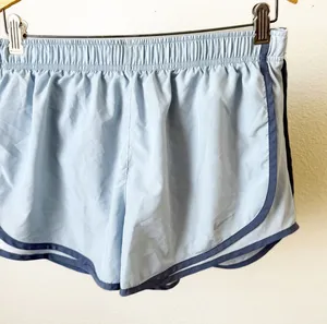 Nike‎ Dri Fit Running Shorts Light Blue Dolphin Hem Athletic Womens Size L thumbnail 1