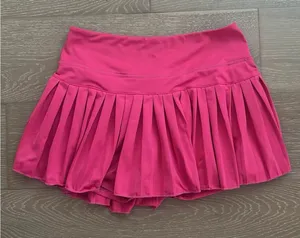 Gold Hinge Pleated Tennis Skirt with Built-In Tennis Shorts Pink thumbnail 1