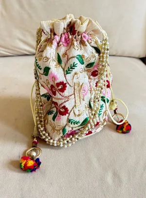 Handmade embroidered floral drawstring bag with pink, red, and green flowers and gold accents. #handmade #embroidered thumbnail 1