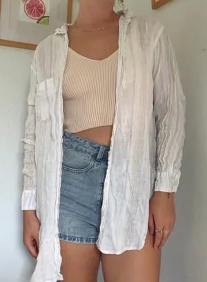 White linen button up shirt with ruffle collar and long sleeves #linen #summer thumbnail 1