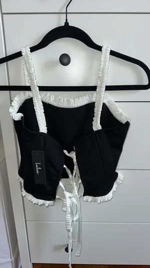 Lulu’s Coquette Charisma Black and White Ruffled Tie-Back Crop Top thumbnail 3