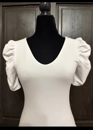 Vylette White bodysuit with Puffy Sleeves - Size Medium. ***refer to measurements. Super Cute top gentle worn and in excellent condition. Cotton/ spandex material. Measurements approximately for the bodysuit/ 14” from armpit to armpit x 25” from shoulder to snaps in crotch. Non-smoking home. Priced to sell at as is condition. Don’t like my price please make reasonable offer. thumbnail 2