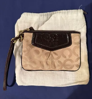 Coach beige C logo wristlet with brown patent leather details thumbnail 1
