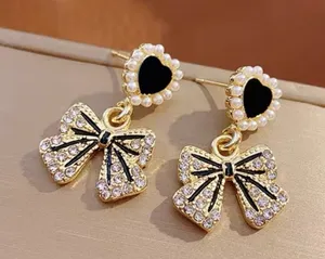 Gold Plated Bow Earrings thumbnail 1