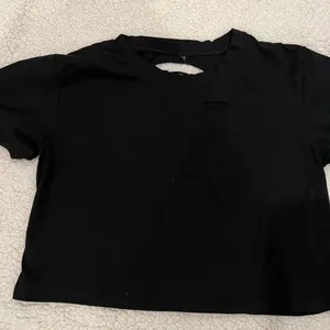 Womens cropped ripped distressed T-Shirt Size Medium. Rips on front and back thumbnail 1