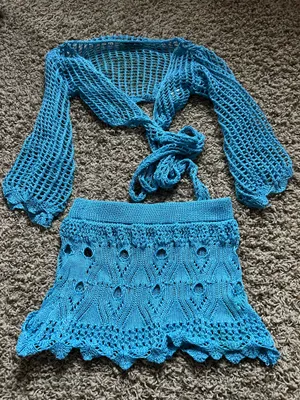 SheIn Lightweight open-knit crop top with tie-front detail. Matching crochet mini skirt with scalloped hem. Vibrant turquoise color perfect for layering or beachwear. thumbnail 1