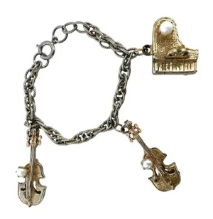 Vintage gold tone faux pearl instrument charm bracelet thumbnail 1
