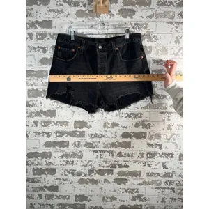 Levi’s | women black button fly denim shorts distressed thumbnail 8