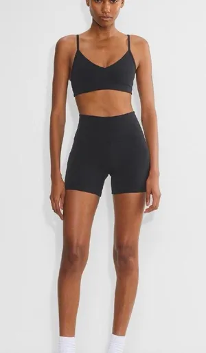 Aritzia Tna Butter Set this set comes with cheeky biker shorts, hold tight bra, and butter bound t-shirt all in black set retails for $136 thumbnail 7