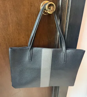 Vince Camuto Pebbled Vegan Leather Luck Tote in black with gray stripe thumbnail 1