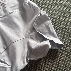Jaanuu Peplum scrub top thumbnail 5