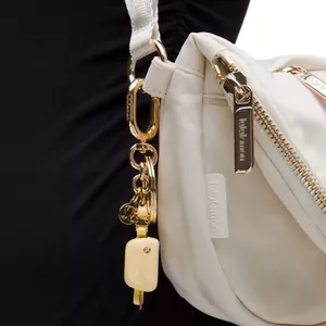 Lululemon Everywhere Belt Bag Key Charm Butter Cream/Gold Key Charm thumbnail 3