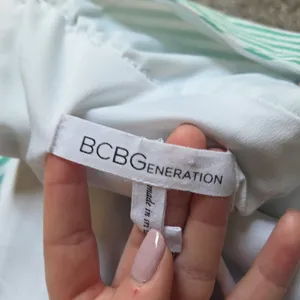 BCBGeneration Green and White Striped V-Neck Tie Shoulder Dress thumbnail 7
