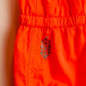 Free People Movement tropic sport one piece orange jumpsuit. Size medium thumbnail 7