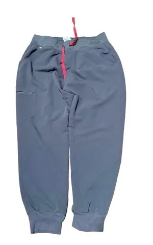 FIGS Zamora Jogger Scrub Pants Charcoal Grey Size Medium FIGS Zamora jogger scrub pants in charcoal grey, size Medium/Petite. Jogger cut with tapered leg and elastic ankle. Red drawstring waistband, zippered pocket. Technical Collection fabric, Threads for Threads edition. Pre-owned, no visible wear. thumbnail 1