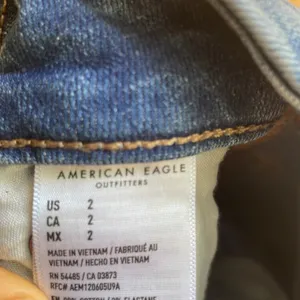 American Eagle ripped Jean skirt thumbnail 4