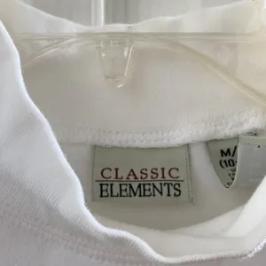 FINAL MARKDOWN Ladies’ Classic Elements Classic Mock Neck Short-sleeved top (M). thumbnail 4