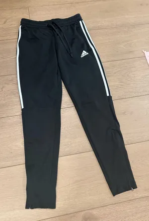 Black Adidas zip-leg joggers with pockets and drawstrings thumbnail 1