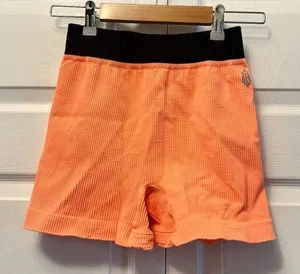 Free People Movement prajna bright orange shorts NWOT M/L‎ thumbnail 1