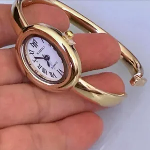Brand New y2k style gold bangle watch with white face and Roman numerals thumbnail 3