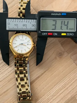 Seiko Vintage Watch Gold Bracelet Case White Dial Blue Gold Hands Date Window thumbnail 13