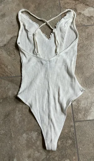 Forever 21 white ribbed bodysuit with a plunging V-neckline is a size small. thumbnail 2