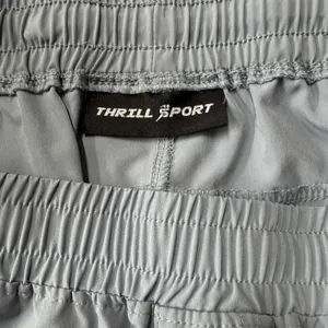 These Thrill Performance athletic shorts‎ feature a lightweight grey fabric Gray Size L thumbnail 9