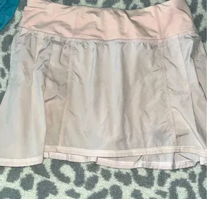 Lululemon ruffled skirt, size 2, and a light pink color thumbnail 1