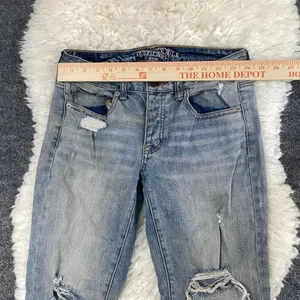 AMERICAN EAGLE LIGHT BLUE DISTRESSED BUTTON FLY BOY JEAN DENIM MID RISE thumbnail 2