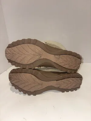 U.S. Polo Assn. Women's Yvonne Snow Boots in an "Oatmeal" or beige colorway. These mid-calf winter boots feature a duck-toe rubber shell base for slush protection, a quilted canvas shaft, traditional lace-up closure, and a plush faux-fur collar trim. A signature metallic logo plaque is attached to the side strap thumbnail 6