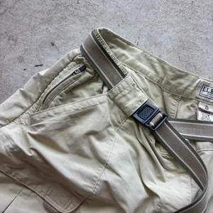 L.L. Bean convertible cargo hiking pants feature a built-in webbed belt and zip-off lower legs. thumbnail 4