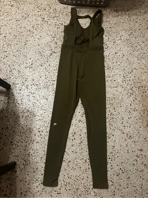 Fabletics Motion 365 onesie in olive green features a racerback design thumbnail 7
