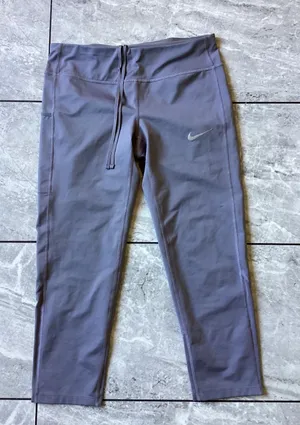 Nike Dri-FIT Womens Purple Crop Running Leggings Mesh Zipper Pocket Size M thumbnail 1