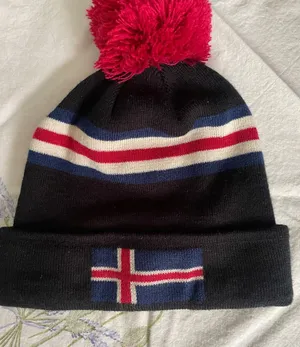 Black Knit Pom Beanie with Red Pom and Striped Accents- Iceland thumbnail 1